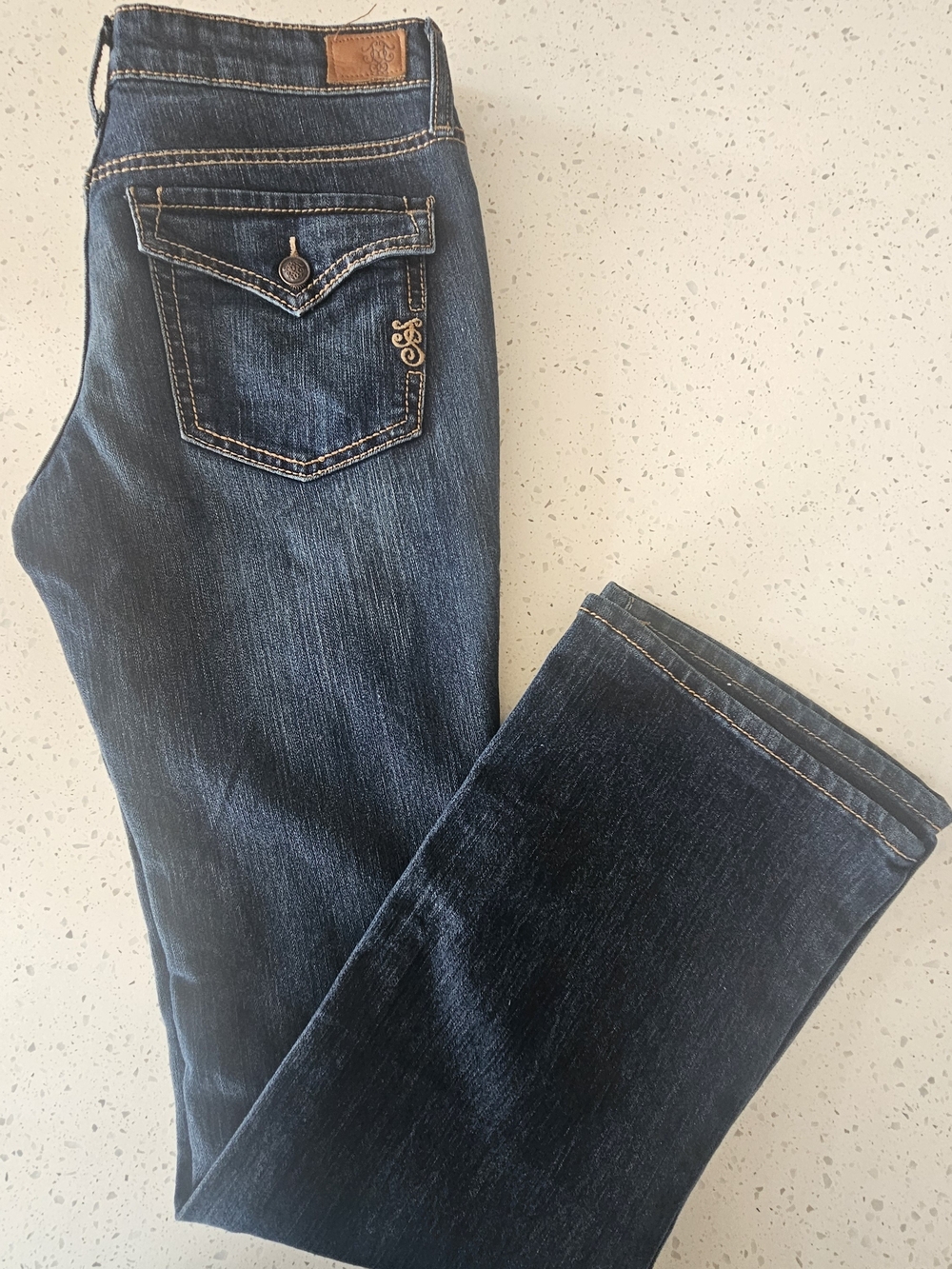 Jessica Simpson Sunshine Skinny Boot Jeans in a dark wash.